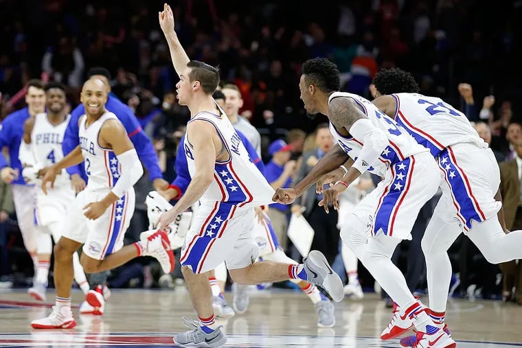 T.J. McConnell celebrates his game-winning basket with his teammates against the New York Knicks.