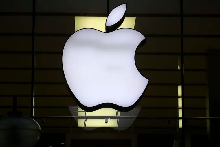 The Apple logo is illuminated at a store in the city center in Munich, Germany in 2020.