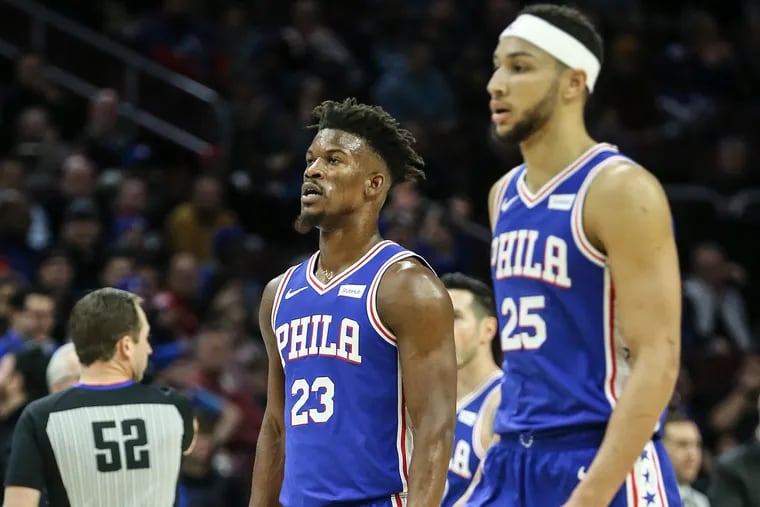 Sixers' Jimmy Butler and Ben Simmons walk off the court during a timeout against the Pistons during the 1st quarter at the Wells Fargo Center in Philadelphia, Monday, December 10, 2018. Butler later injured his groin in the 1st quarter.  STEVEN M. FALK / Staff Photographer