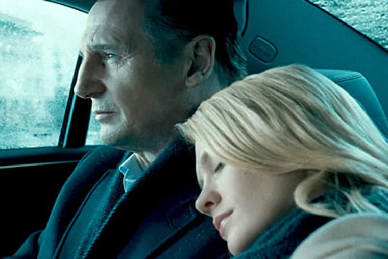 Liam Neeson, left, and January Jones in "Unknown." (AP Photo / Warner Bros. Pictures)