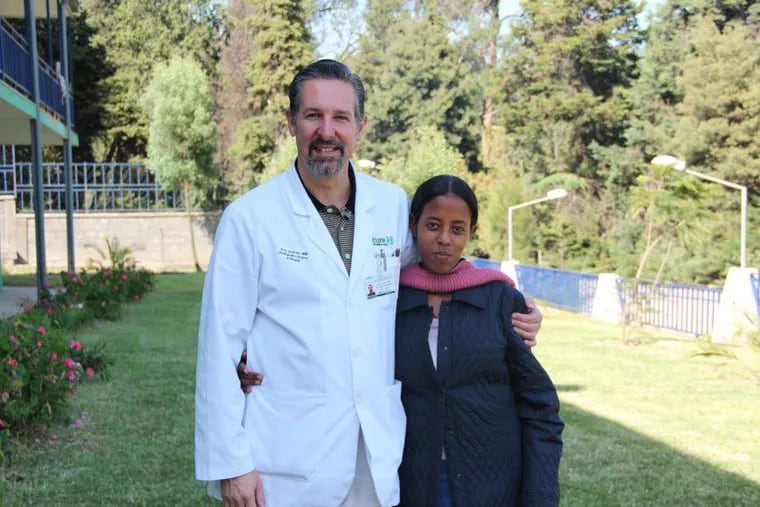 Dr. Eric Gokcen and Workitu, an Ethiopian teenager whose severe birth deformities were corrected by Gokcen and his surgical team.
