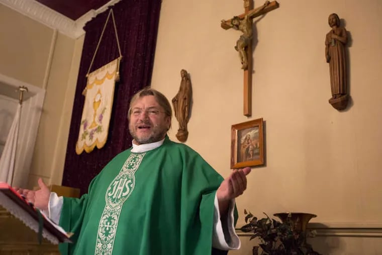 Rev. Krzysztof Wtorek, of St. Joseph’s (Polish) Church in Camden, celebrates morning Mass Friday at the church in the city’s Whitman Park section. St. Joe’s will become part of the Cathedral of the Immaculate Conception downtown.
