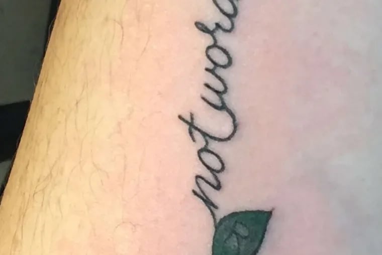 Mourning the loss of her candidate, Beth Moore of the Graduate Hospital section got a tattoo with the suffragist slogan &quot;Deeds not Words,&quot; and Hillary Clinton's initials worked into the leaves.