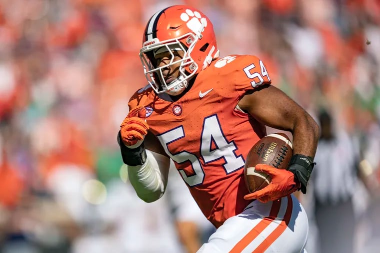 Clemson linebacker Jeremiah Trotter Jr. returns an interception for a touchdown during the first half of an NCAA college football game against Notre Dame, Saturday, Nov. 4, 2023, in Clemson, S.C. (AP Photo/Jacob Kupferman)