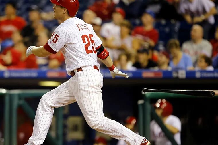 Phillies' Cody Asche watches his game winning two-run home run to beat the Chicago Cubs on Saturday, September 12, 2015 in Philadelphia.