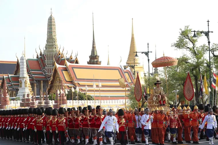 Thailand’s King Maha Vajiralongkorn is carried on a palanquin through the streets outside the Grand Palace for the public to pay homage during the second day of his coronation ceremony in Bangkok, Sunday, May 5, 2019. Vajiralongkorn was officially crowned Saturday amid the splendor of the country's Grand Palace, taking the central role in an elaborate centuries-old royal ceremony that was last held almost seven decades ago. (AP Photo/Rapeephat Sitichailapa)