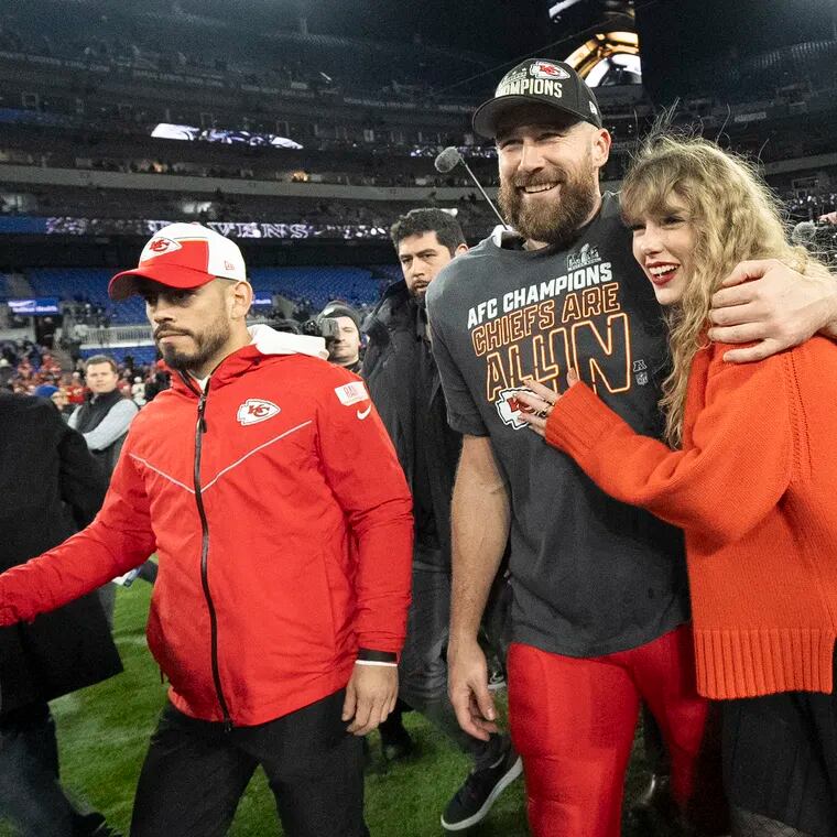 Kansas City Chiefs tight end Travis Kelce and Taylor Swift walk together after the 2024 AFC Championship game.