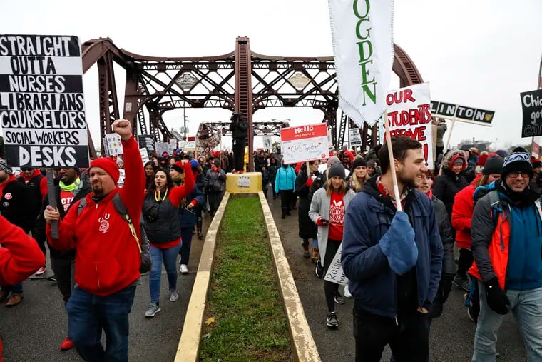 Chicago Teachers Union members march near the Lincoln Yards development on Oct. 29 during an 11-day strike.