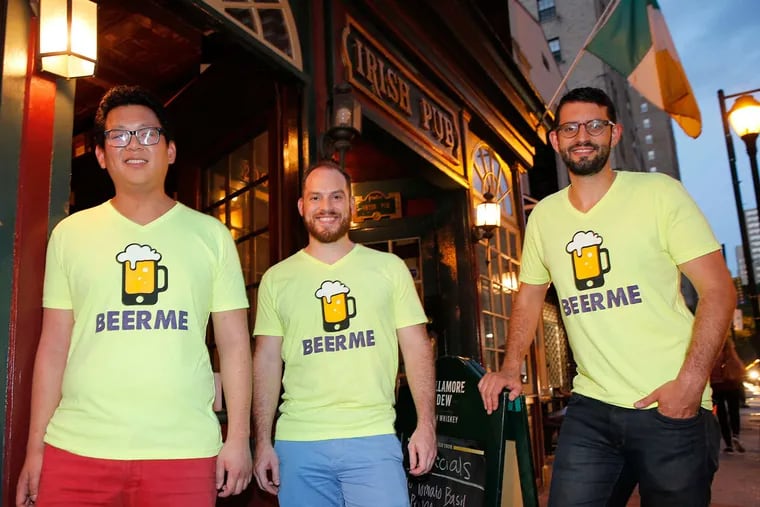 BeerMe app founders (from left) Ted Lui, Mark Kozlowski, and Evan Glickman outside the Irish Pub on Walnut Street near 20th. Several bars and nightclubs in Philadelphia are using the app.