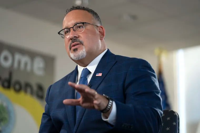 Education Secretary Miguel Cardona speaks during an interview with The Associated Press in his office at the Department of Education, Wednesday, Sept. 20, 2023 in Washington. (AP Photo/Mark Schiefelbein)