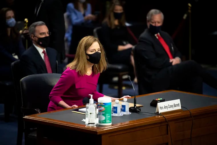 Supreme Court nominee Amy Coney Barrett arrives for her Senate Judiciary Committee confirmation hearing on Capitol Hill in Washington, Monday, Oct. 12, 2020.