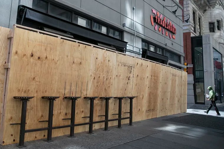 Some blocks of Center City appear as if the businesses are preparing for a hurricane.
