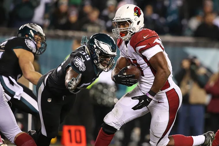 Cardinals running back David Johnson scores a two-yard touchdown against the Eagles.
