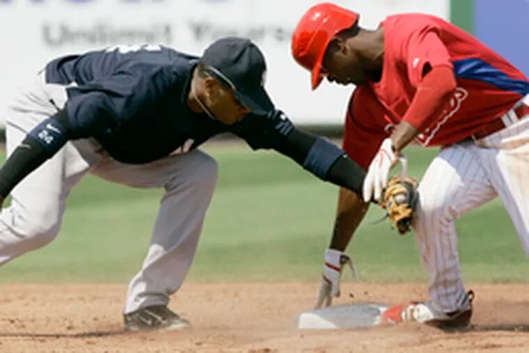 Jimmy Rollins steals second base ahead of the tag by Yankees second baseman Robinson Cano in the seventh inning of the Phillies&#0039; 4-0 exhibition win.