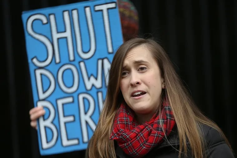 Emma Pajer, a Temple University law student working with the school's Sheller Center for Social Justice, calls for the closure of the Berks County migrant detention center during a rally in Center City on Feb. 20, 2020.