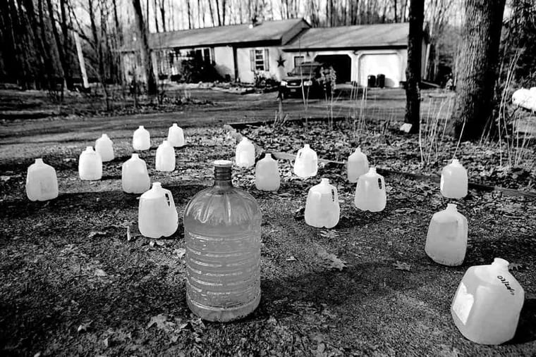 Containers of water outside a home in Dimock, Pa., where regulators say the wells of 18 people were tainted by Marcellus Shale gas drilling. Extension of municipal water service to the residents has been approved, with costs to be paid by the driller, Cabot Oil & Gas Co.