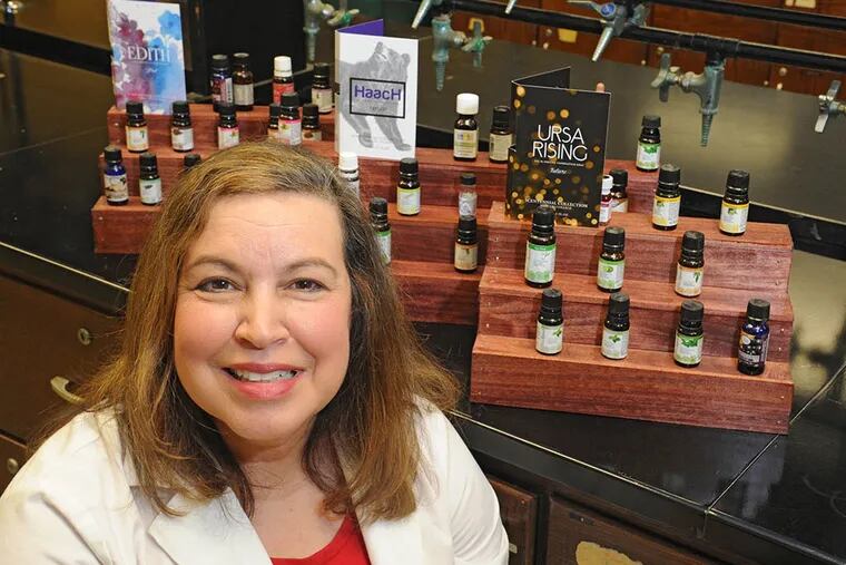 That 100-year smell: Harcum College chemistry professor Alexandra Hilosky, who studied perfume-making in France, developed three scents to promote the school’s centennial — or, as she suggested calling it, the “Scentennial.” (CLEM MURRAY / Staff Photographer)