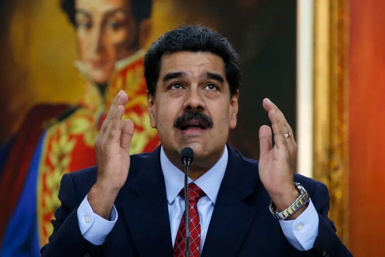 Venezuelan President Nicolas Maduro gives a press conference at Miraflores presidential palace in Caracas, Venezuela, Friday, Jan. 25, 2019, amid a political power struggle between him and an opposition leader who has declared himself interim president. (AP Photo/Ariana Cubillos)