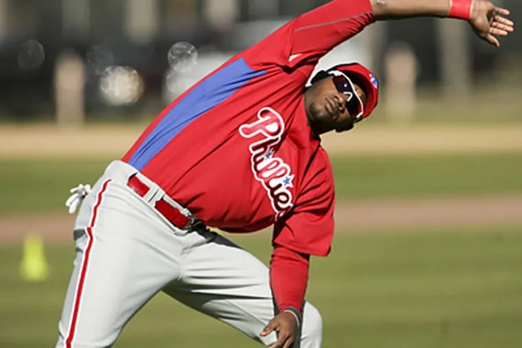 Phillies' minor leaguer Domonic Brown stretches during spring training workouts at Bright House Field. (Yong Kim / Staff Photographer)