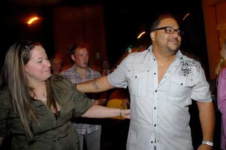 Kevin Sbraga from Willingboro won America's Top Chef and was on-hand in Philadelphia At Osteria Restaurant when the show aired.  His wife Jesmary Sbraga, left. ( April Saul / Staff Photographer )