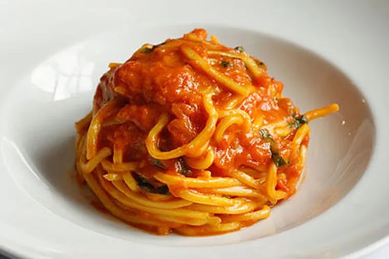 Spaghetti tomato & basil is a signature dish from Scarpetta.