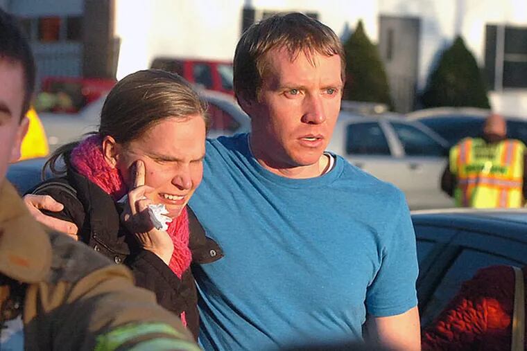 Robert and Alissa Parker leave the Sandy Hook Volunteer Fire House in tears after a shooting at the Sandy Hook Elementary School, Friday morning, Dec. 14, 2012 in Newtown, Conn. A man opened fire Friday inside two classrooms at the Connecticut elementary school, killing 26 children and adults, including the Parkers' daughter Emilie. (AP Photo/The Hour, Alex von Kleydorff)