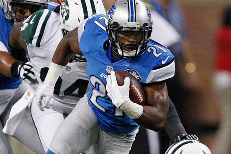 Detroit Lions running back Ameer Abdullah (21) evades a tackle from New York Jets free safety Calvin Pryor (25) during the first quarter of a preseason NFL football game at Ford Field.