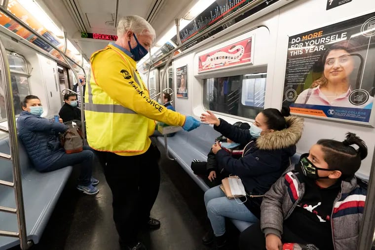Patrick Foye, Chairman and CEO of the Metropolitan Transportation Authority, handed out face masks on a New York City subway Nov. 17, 2020.