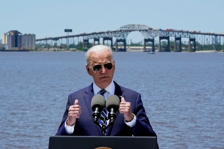 President Joe Biden speaking with the Interstate 10 Calcasieu River Bridge behind him on May 6 in Lake Charles, La.