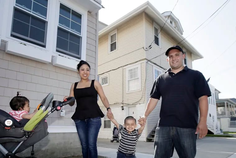 Christopher Vincente Salvatore Camino (right), wife Hilaria Zamora-Sauce, children Elizabeth Camino, 1, (left) and Christopher Camino, 2, at the family's Ventnor beach house. Camino’s grandfather Salvatore sold the house in 1991, and Chris Camino recently bought it back.