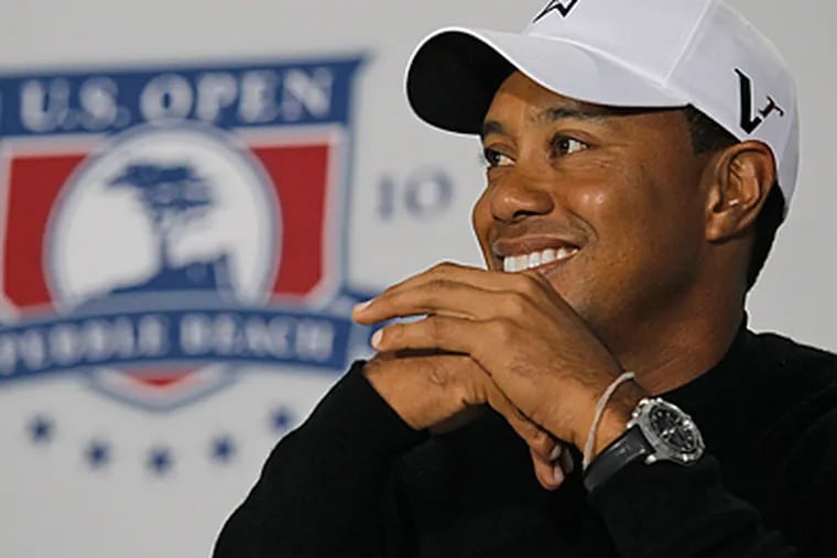 Tiger Woods answers questions after a practice round for the U.S. Open golf tournament. (AP Photo/Eric Risberg)