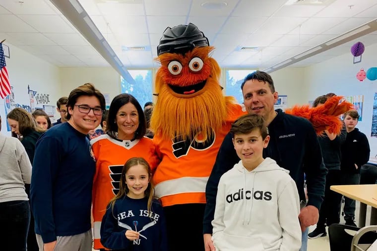 Jennifer Armstrong shown with her family and Flyers mascot Gritty, was awarded a $10,000 donation for new classroom tech devices for being a finalist in the NHL/NHLPA Future Goals Most Valuable Teacher of the Year.