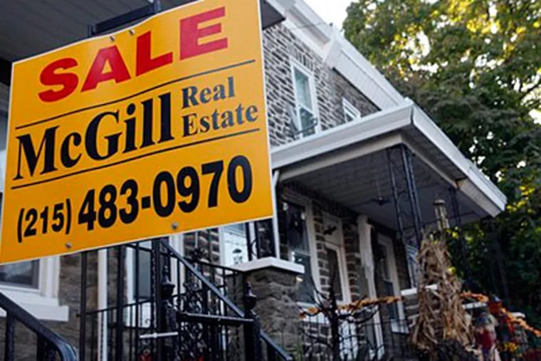 Home resales rose far more than expected last month to the highest level in more than two years as buyers scrambled to complete their purchases before a tax credit for first-time owners expires.(AP Photo/Matt Rourke)
