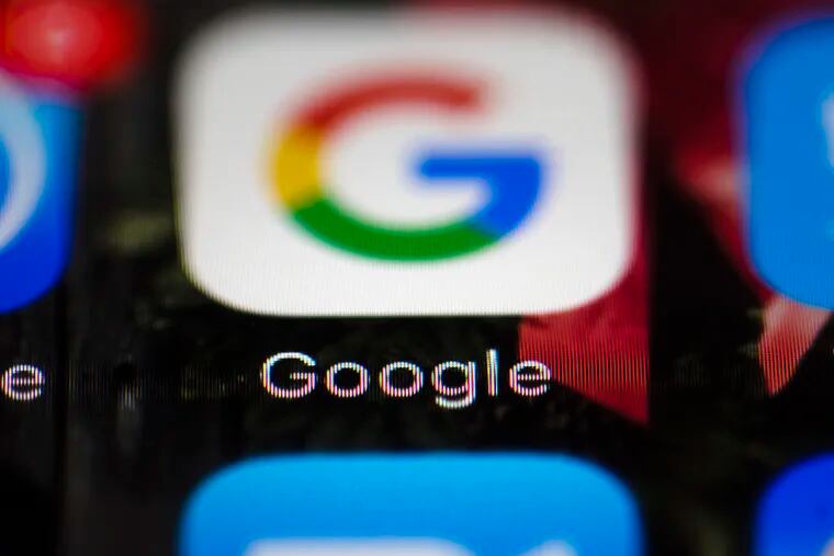 A Google icon on a mobile phone. The company has updated its search results to offer more images, which it says are more useful to the smartphone crowd.