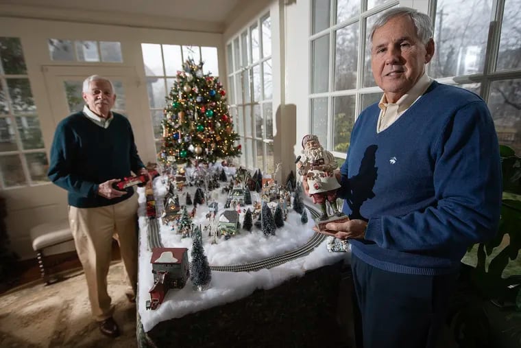 The home of Bruce Davidson (left) and Don Barb in Philadelphia's Chestnut Hill neighborhood is decked out for Christmas. They have six Christmas trees, toy trains and villages, and creches from around the world.