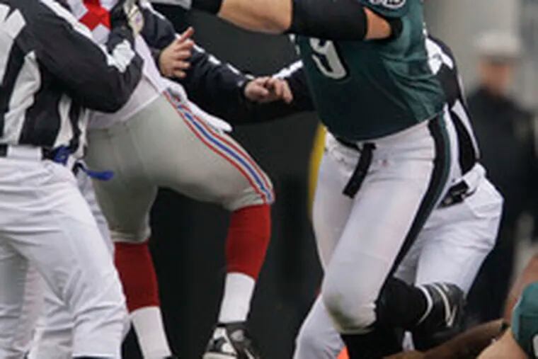 Guard Todd Herremans tosses a Giants defender away from the pile after a Donovan McNabb sneak for a first down.