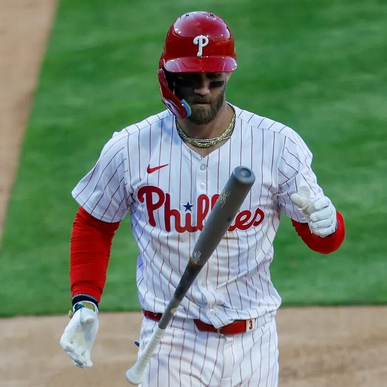 Phillies’ Bryce Harper strikes out swinging in the last out of the eighth inning.