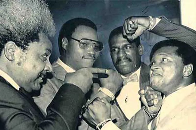 Butch Lewis (right) clowns with (from left) Don  King, Larry Holmes and Michael Spinks as they promote the Holmes vs. Spinks fight in 1985 in New York.