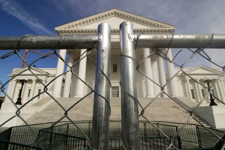 The Virginia Capitol building in Richmond is surrounded by fencing on Thursday in preparation for Monday's rally by gun-rights advocates.