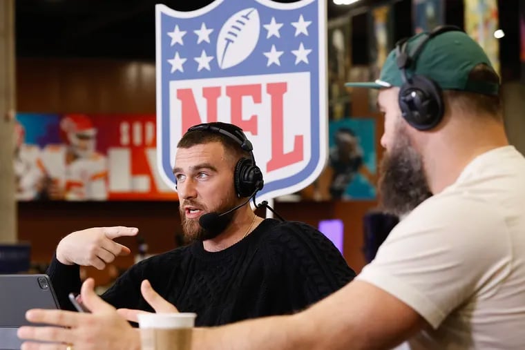 Kansas City Chiefs tight end Travis Kelce points to his brother, Eagles center Jason Kelce, while recording an episode of their “New Heights” podcast ahead of last year's Super Bowl.