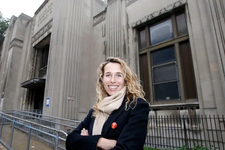 Lindsey Scannapieco, managing partner and principal of Scout Ltd., stands in front of Edward Bok Vocational High School in South Philadelphia on Monday, October 13, 2014. Scout Ltd. recently won a competition to transform the vacant Bok High School in South Philadelphia into a center for design, entrepreneurship and fabrication.  ( YONG KIM / Staff Photographer )