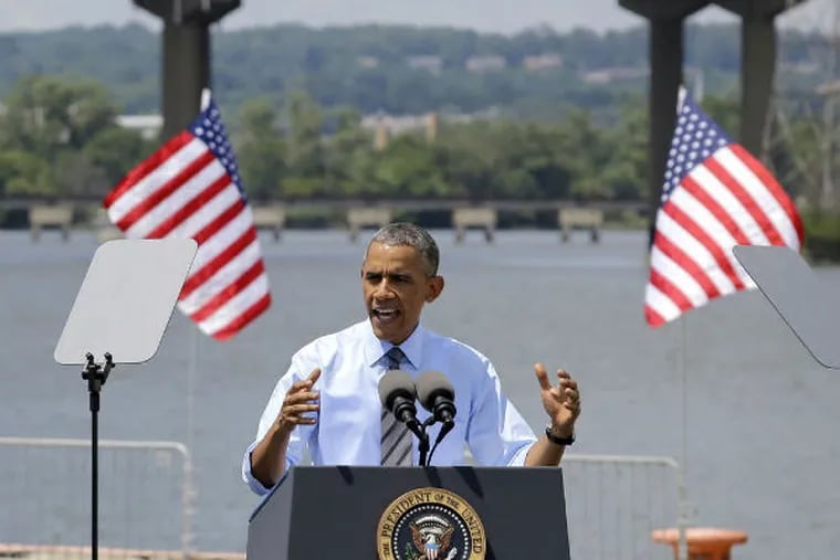 Obama speaking in front of the closed I-495 bridge in Wilmington Thursday. (Patrick Semansy / AP)