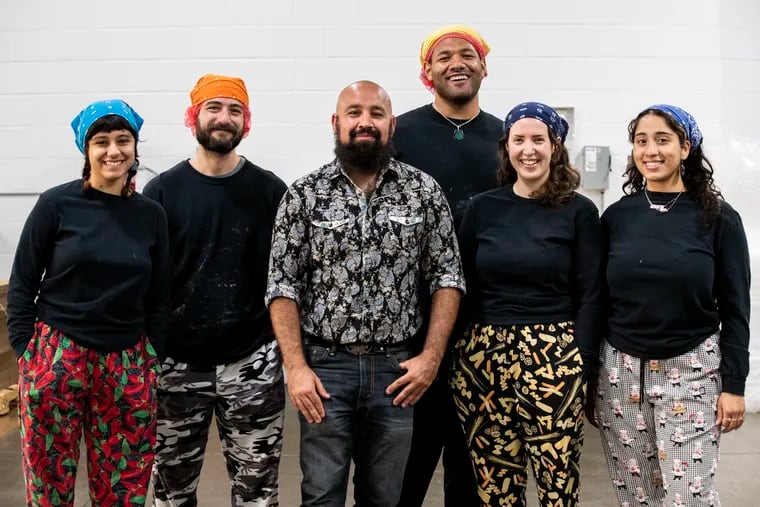 The staff of Bandit, a vegan cheesemaker in South Philly, in the company's basement plant at the Bok Building. From left: Abby Nix, Seamus Gosman, owner Bo Babaki, Antonio Goode, Katie Dougherty, and Julie Saha.