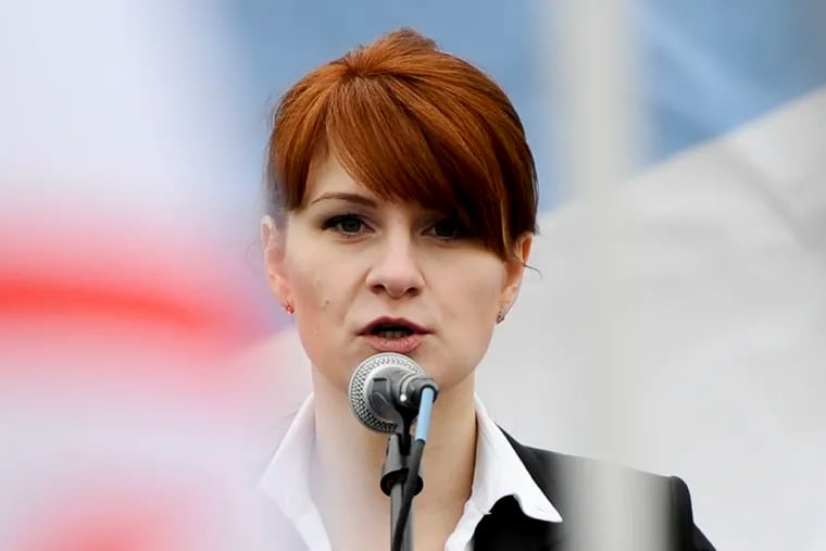 FILE - In this April 21, 2013 file photo, Maria Butina, leader of a pro-gun organization in Russia, speaks to a crowd during a rally in support of legalizing the possession of handguns in Moscow, Russia.   Butina appeared briefly in federal court in Washington on Thursday. U.S. District Judge Tanya Chutkan set Butina’s sentencing for April 26. Butina pleaded guilty in December to a conspiracy charge and agreed to cooperate with U.S. investigators.   (AP Photo/File)