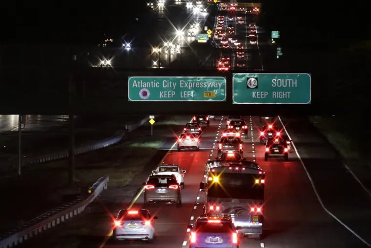 Nighttime traffic moves south on Route 42 in New Jersey, headed onto the Atlantic City Expressway.