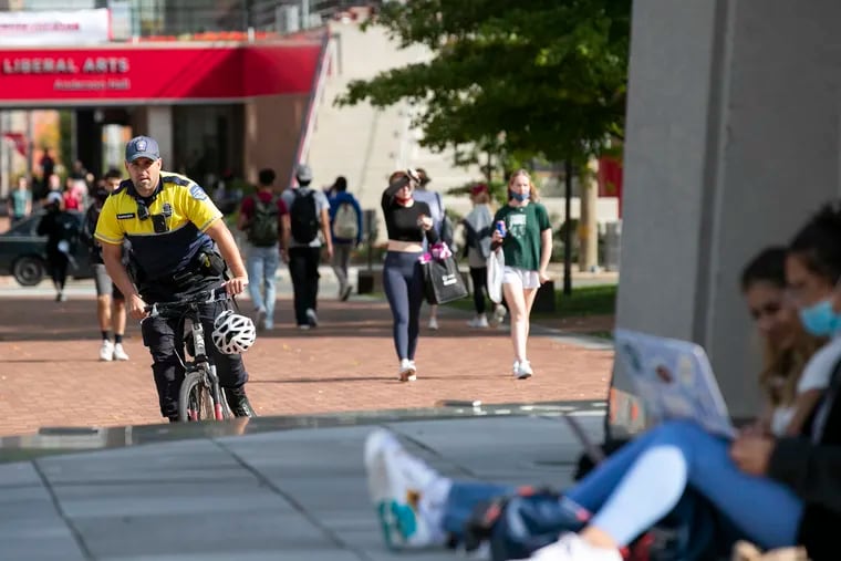 A Temple University police officer bikes around Temple’s campus in Philadelphia on Thursday.
