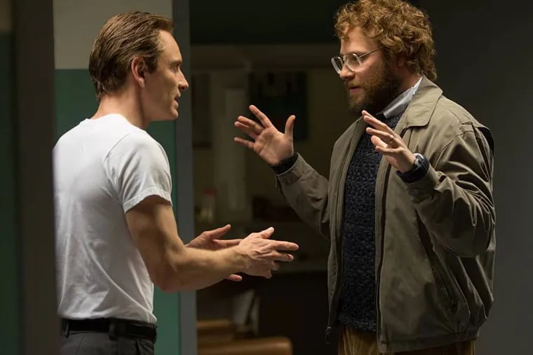 In this image released by Universal Pictures, Michael Fassbender, left, as Steve Jobs, and Seth Rogen as Steve Wozniak, appear in a scene from the film, "Steve Jobs."  (Francois Duhamel/Universal Pictures via AP)