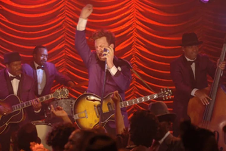 John C. Reilly is Dewey Cox in the spoof, moving from one pop-music idiom to the next over five decades, finally landing in the Rock and Roll Hall of Fame. The movie has fun with every known variety of musical biopic.