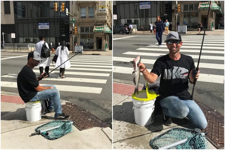 Mike Iaconelli with a catfish he caught out of a storm drain at Broad and Race Streets in Center City Wednesday. Iaconelli's show, "Fish My City," premieres on National Geographic Wild Friday.