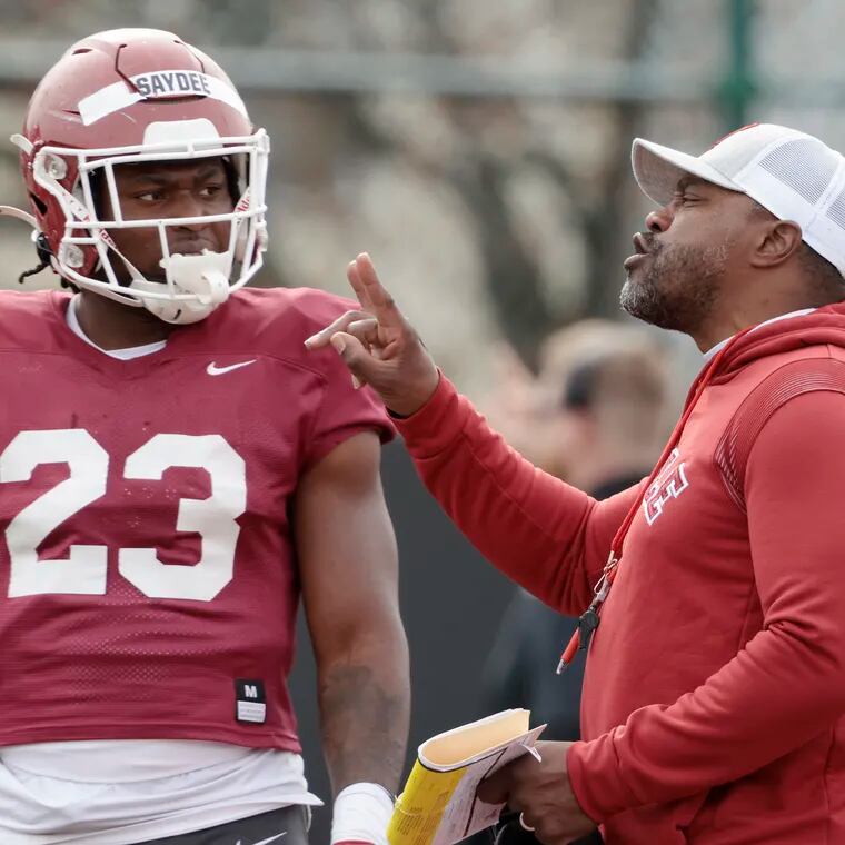 Temple running back Edward Saydee gets instructions from head coach Stan Drayton during the Owls' annual Cherry and White football game at Temple’s Edberg-Olson Field on April 8, 2023.